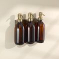 triple-gold-holder-with-amber-glass-soap-dispensers-with-gold-stainless-steel-pump.jpg